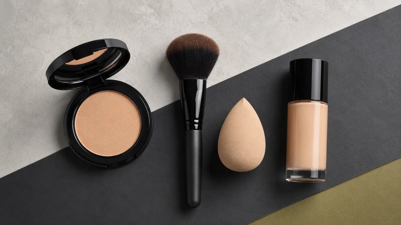 Powder and liquid foundation with a compact, brush, and makeup sponge
