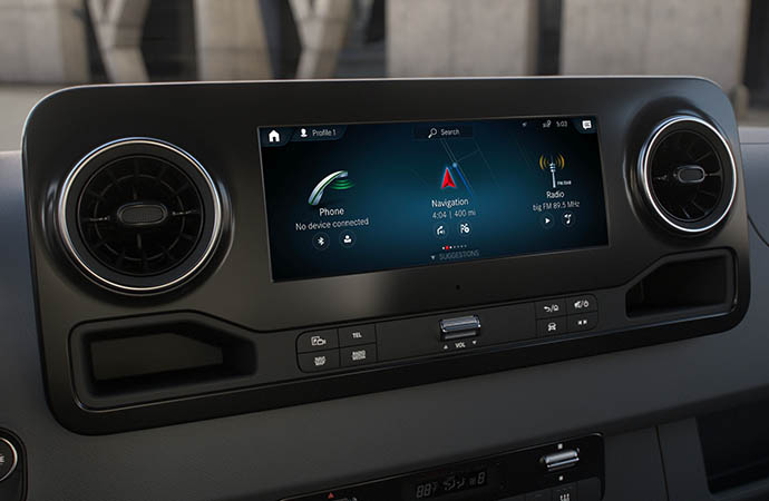 Touchscreen infotainment display showing Phone, Navigation, and Radio options on a vehicle's center console