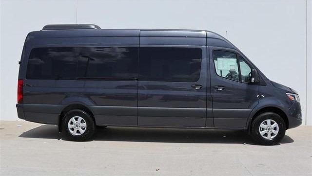 Dark gray Mercedes-Benz Sprinter passenger van, side profile view, high-roof extended length