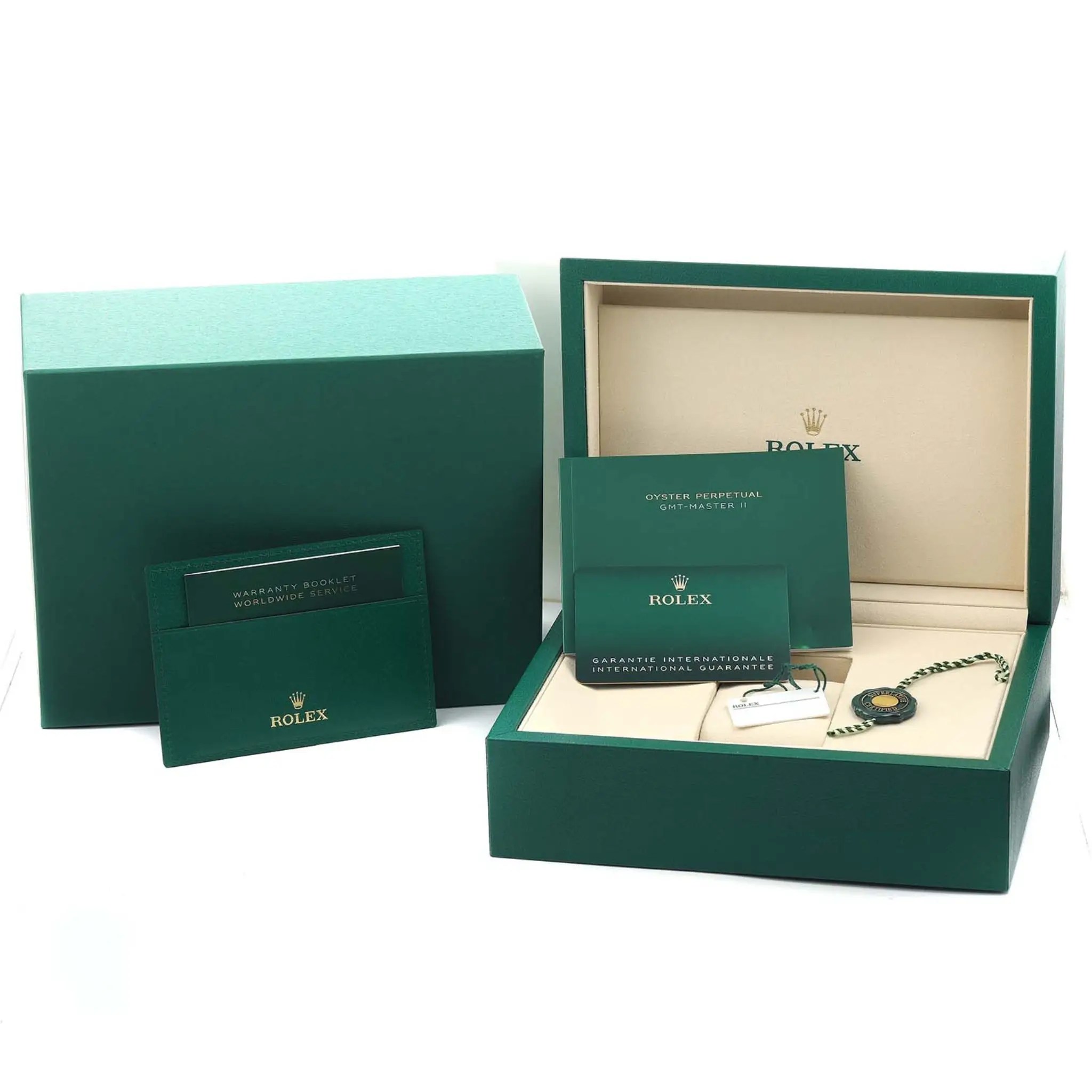 Rolex box, tag, and card.