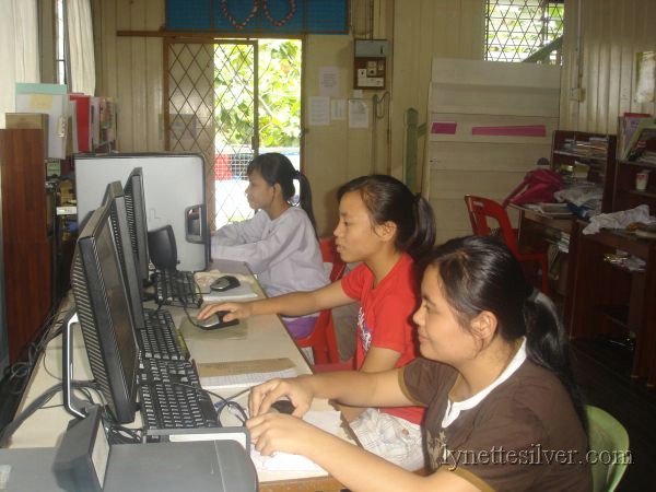 Students with computers Students with computers