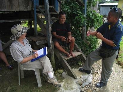 Domoit Kenitur tells his story to Lynette Silver, with the assistance of Dusun translator Sadhib Miki, at Miruru village