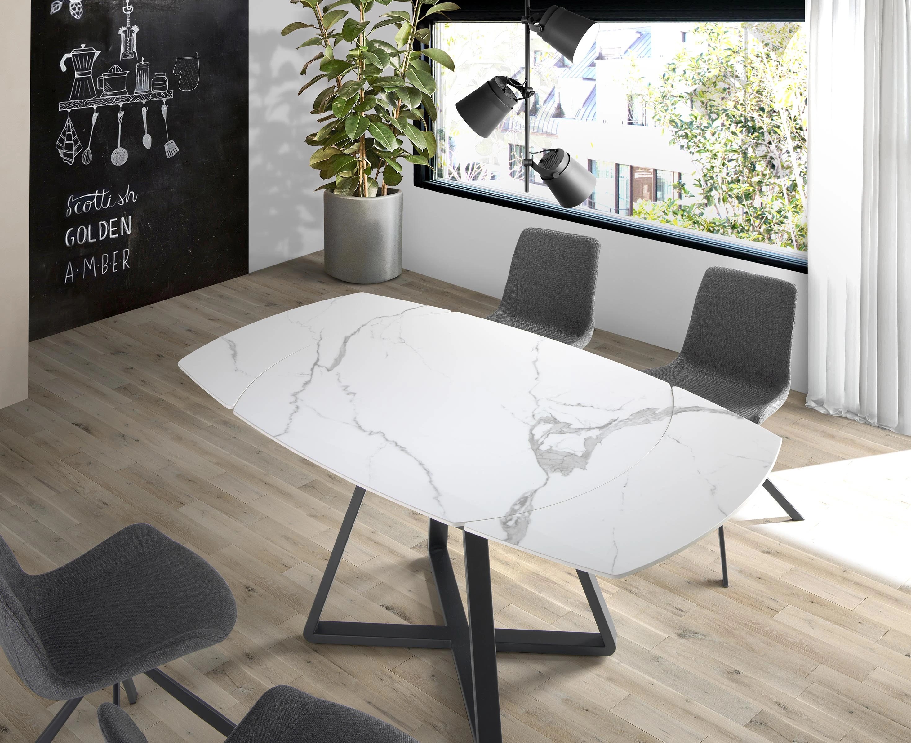 Table à manger à rallonge baril ovale marbre porcelaine et acier noir