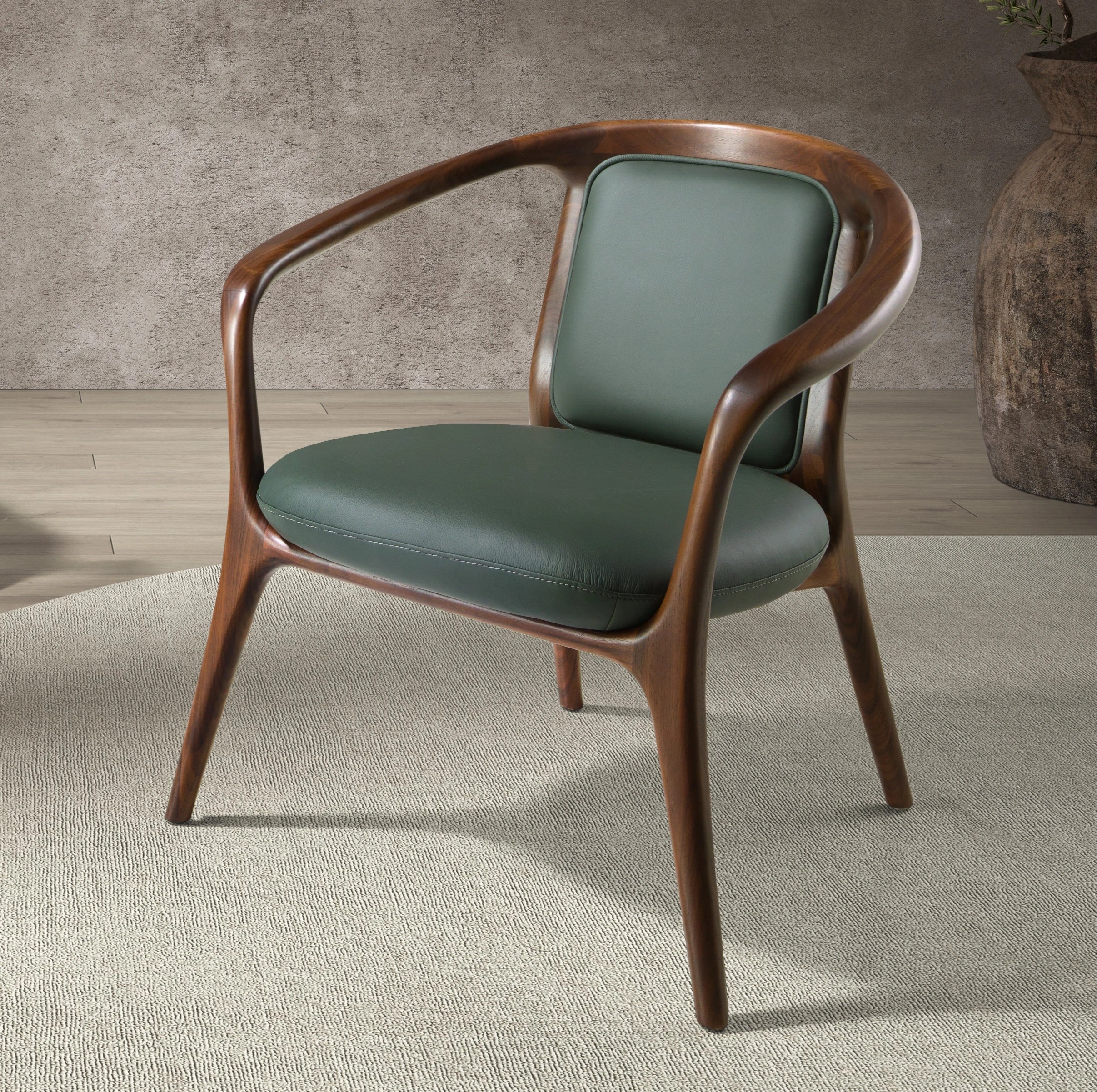 Fauteuil en similicuir vert foncé