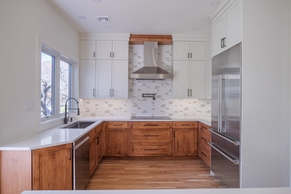 U shaped kitchen remodel with two tone cabinetry and stainless range hood in Lexington MA U shaped kitchen remodel with two tone cabinetry and stainless range hood in Lexington MA