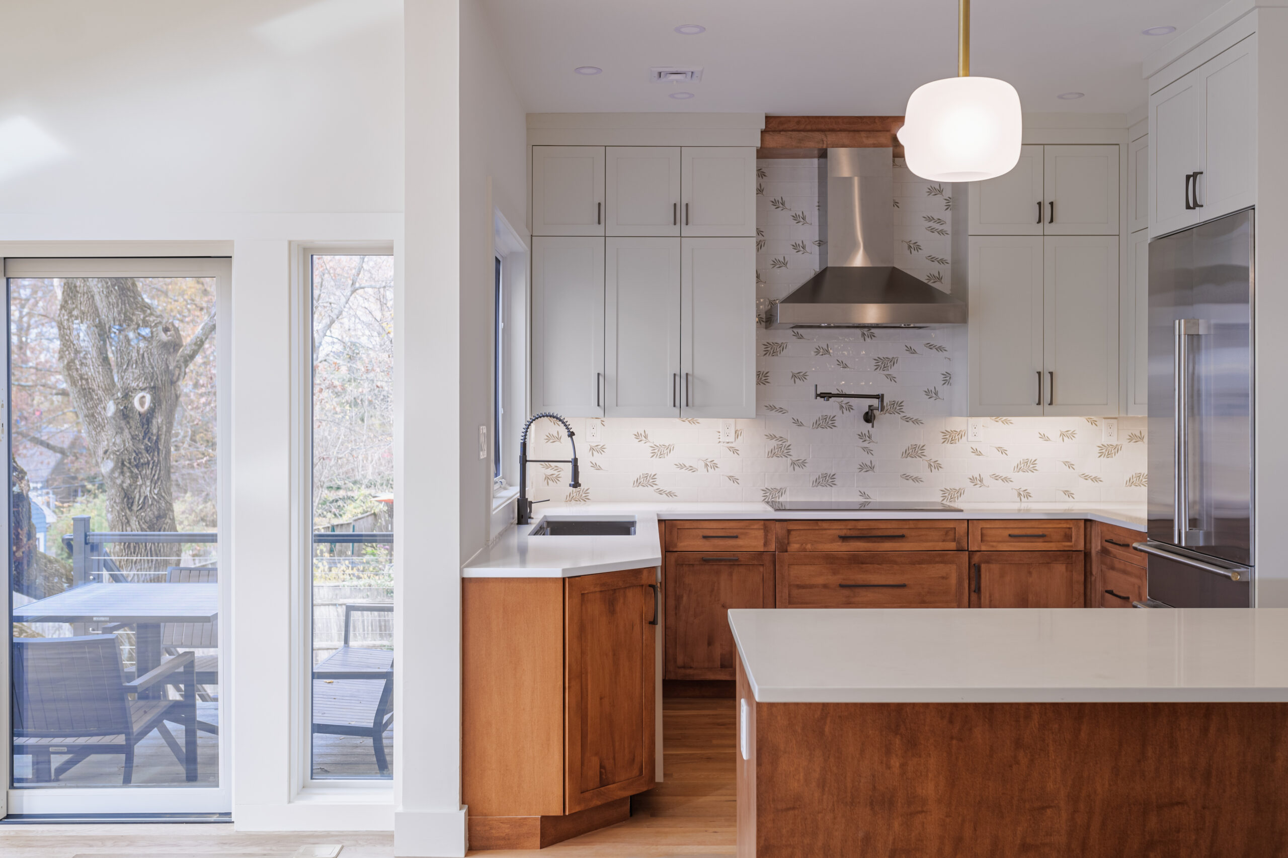 Kitchen renovation with quartz island and deck access in Lexington MA