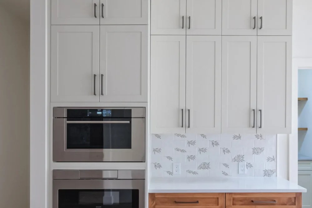 Built in wall ovens and full height cabinetry in a Lexington MA kitchen remodel
