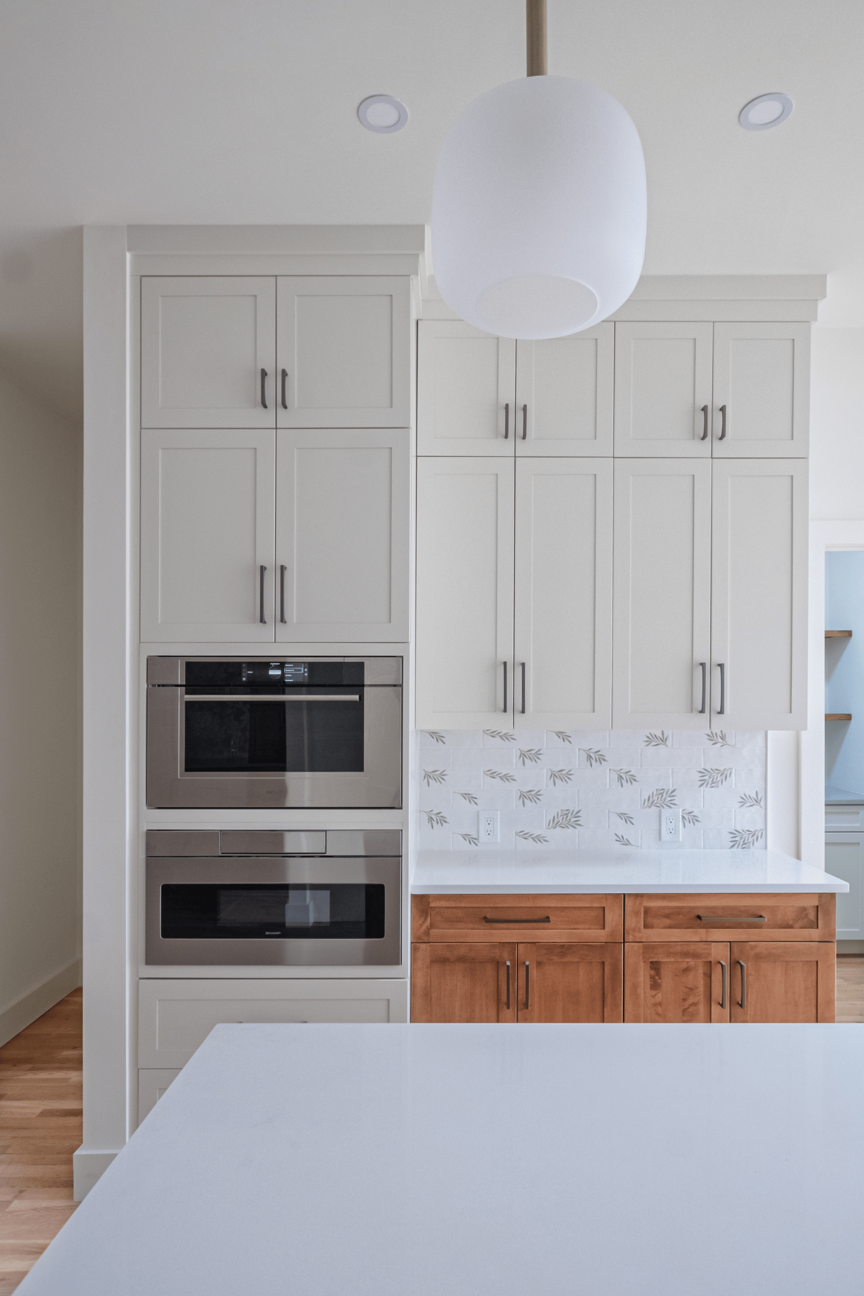 Built in wall ovens and full height cabinetry in a Lexington MA kitchen remodel
