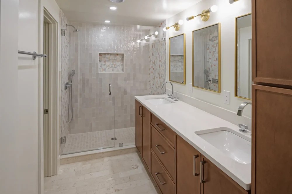 Bathroom remodel with double vanity and walk in tile shower in Lexington MA
