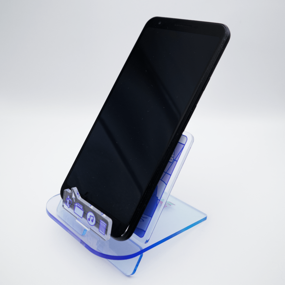 Phone and notepad desk organizer holding a phone