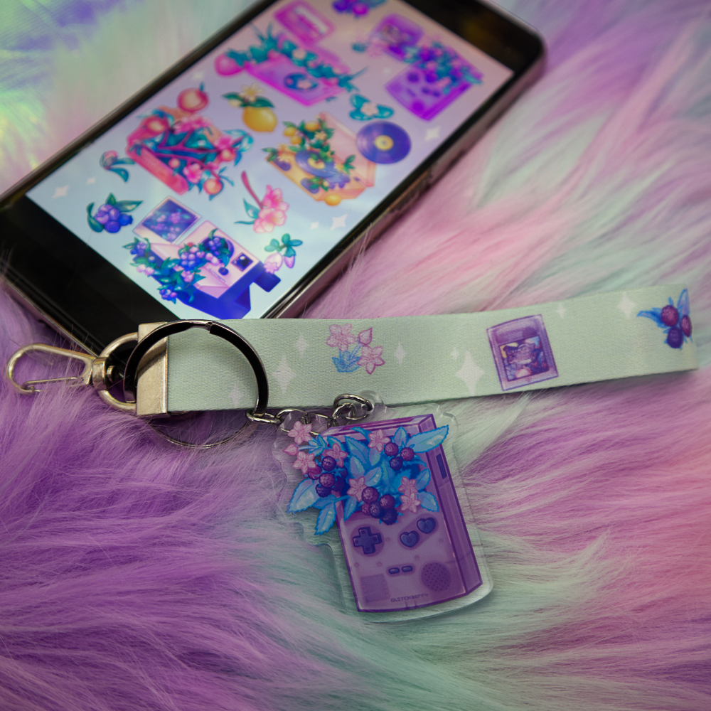 Raspberry Game Toy Wrist Lanyard attached to a phone