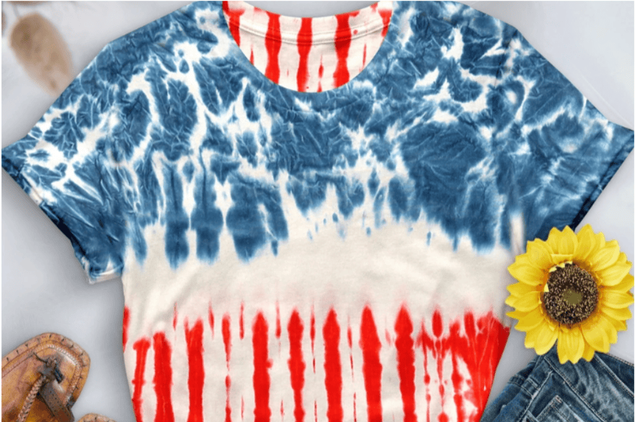 close up of tie dyed American flag shirt as part of a capsule wardrobe