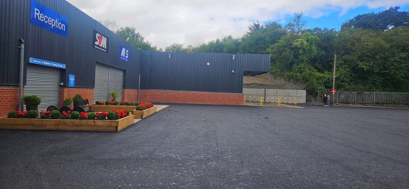 Reception entrance with flower beds and MTS and SVM signs