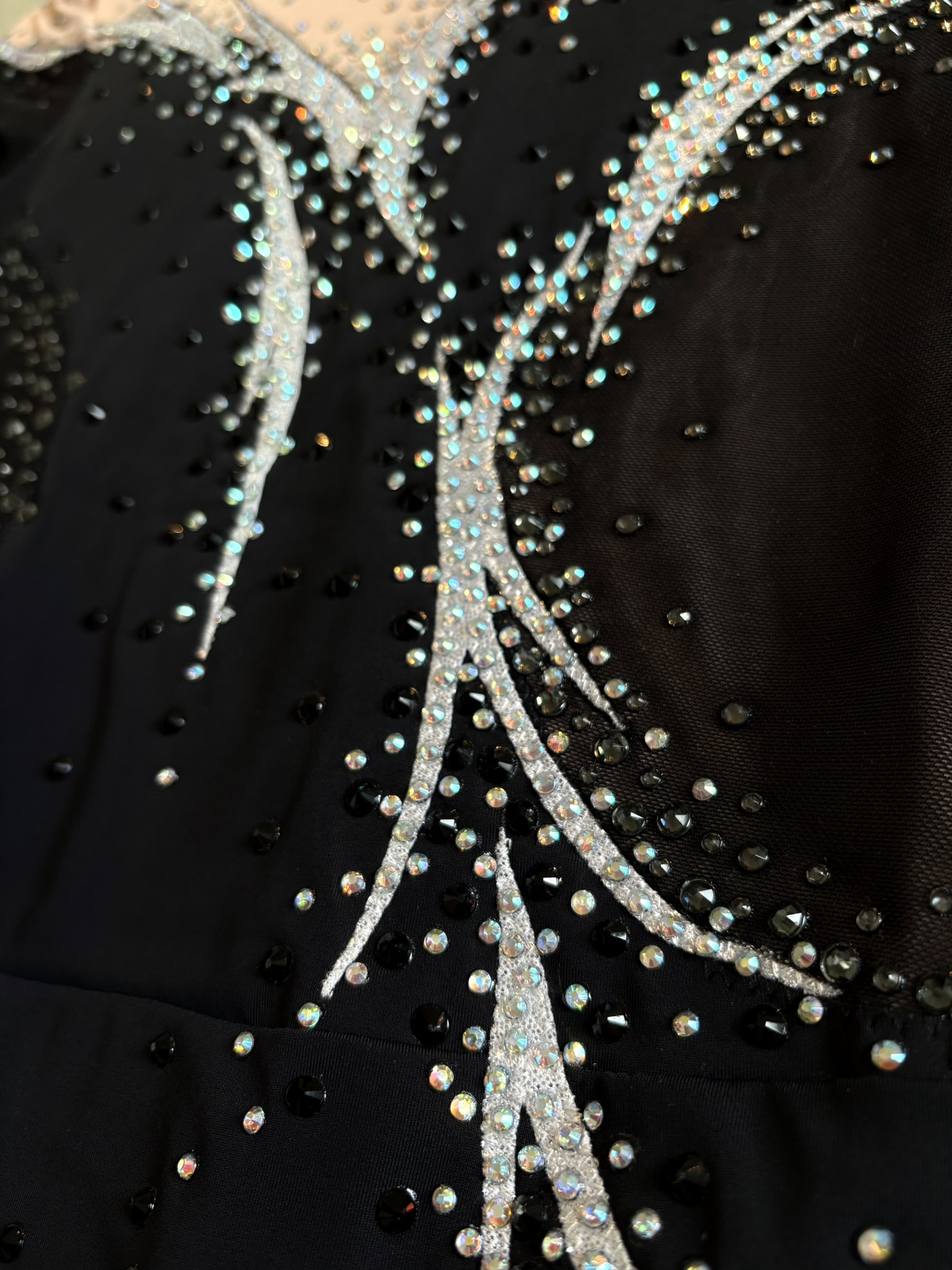 Handmade luxury competition outfit with intricate details for rhythmic gymnastics and acro pairs.