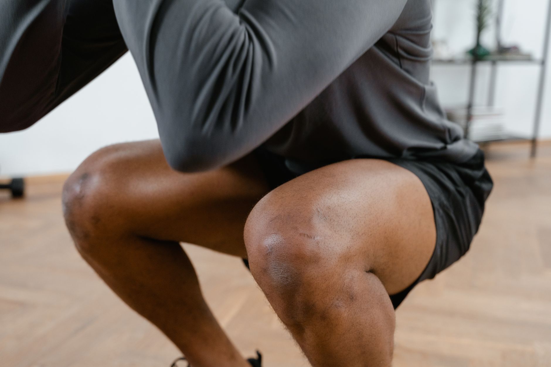 close up of man doing a squat