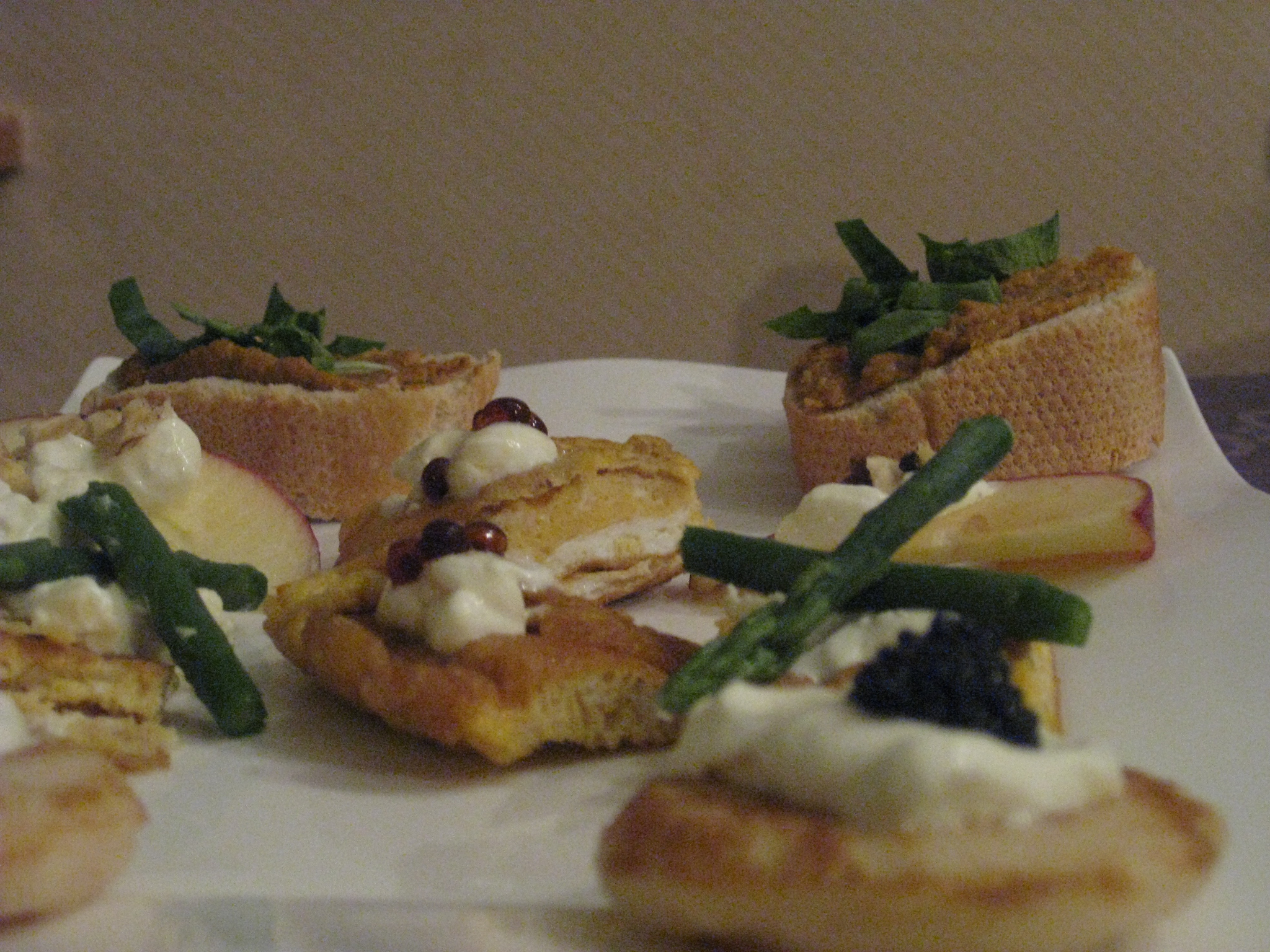 mini blinis with sour cream and lump-fish roe, baguette with tapenade and lamb's lettuce, omelette with sour cream and soja pearls.