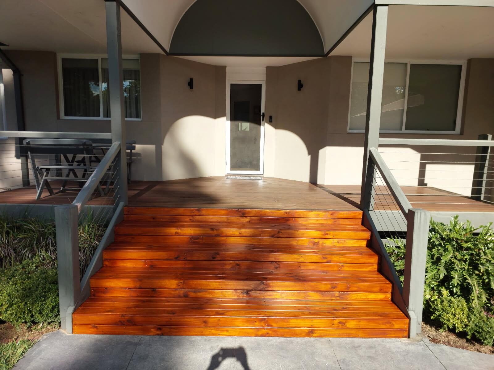 Completed timber entry stairs with metal balustrades