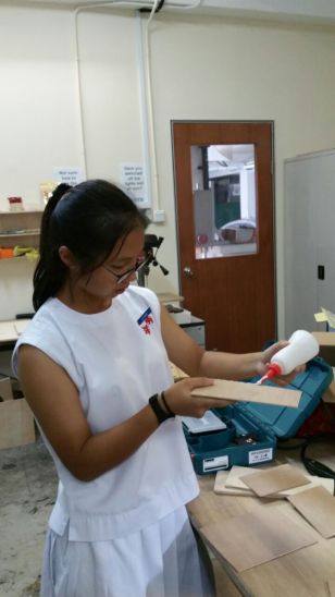 Chantel gluing the wood together