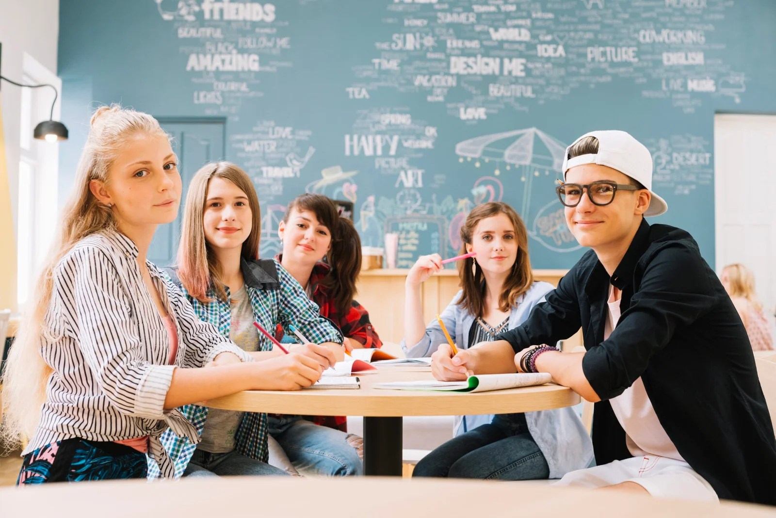 group-students-posing-table
