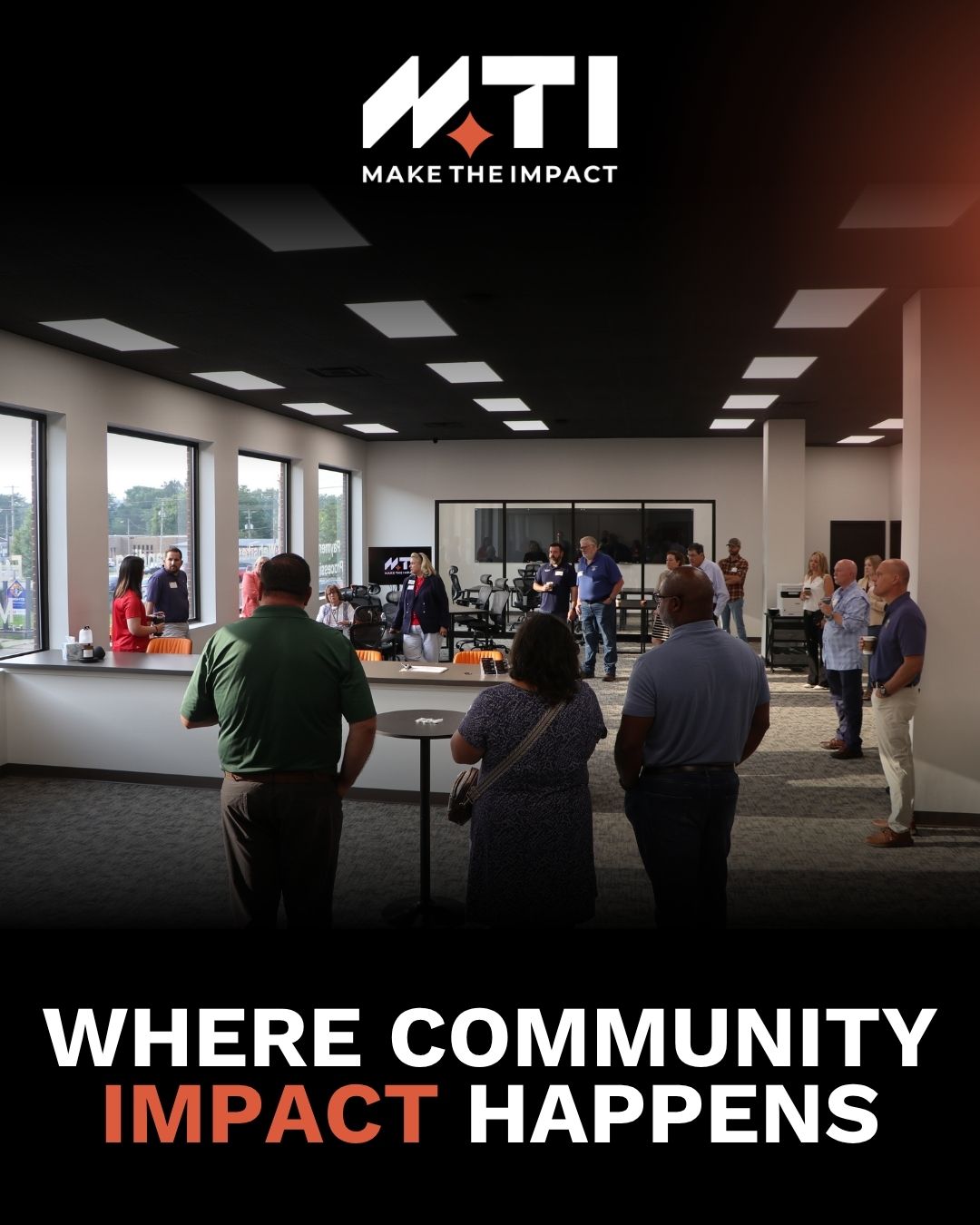 Group of people in a modern office lobby area, gathered and talking, with the MTI Make The Impact logo above and the caption 'Where Community Impact Happens' at the bottom.