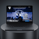 Laptop on a circular pedestal displaying a futuristic bus scene on its screen against a dark background.