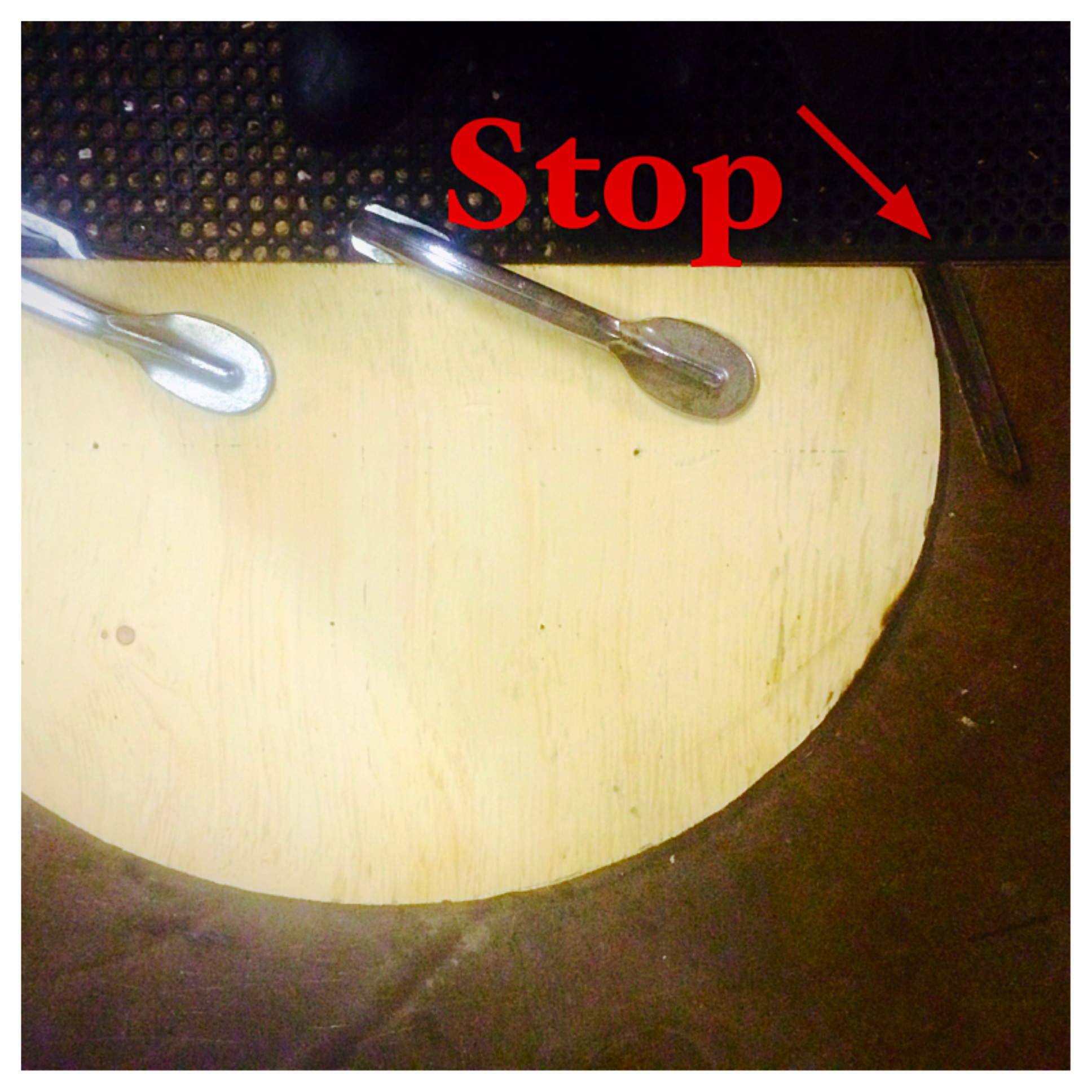 Secure the template to the bench using a couple of clamps. Then tack weld a stop next to the template, leaving enough room for the 3/8" square stock. The jig is now ready.