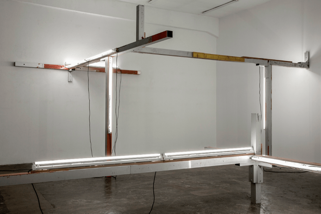 Pedro Cabrita Reis, A Remote Whisper (Studio Version), 2013. Aluminium, fluorescent fixtures mounted on MDF, electric cable, laminated glass, Variable dimensions (site specific), PCRSTUDIO/ João Ferro Martins, Courtesy of the Artist.