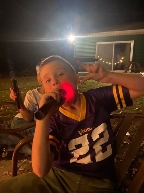 flashlight in boys mouth