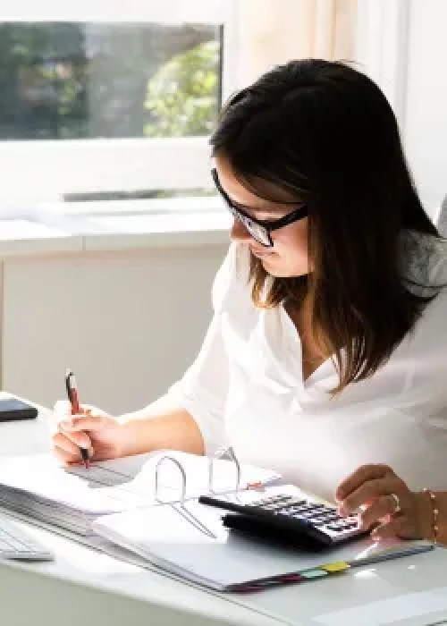 woman writing in binder