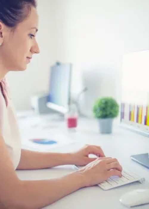 woman at desk and computer