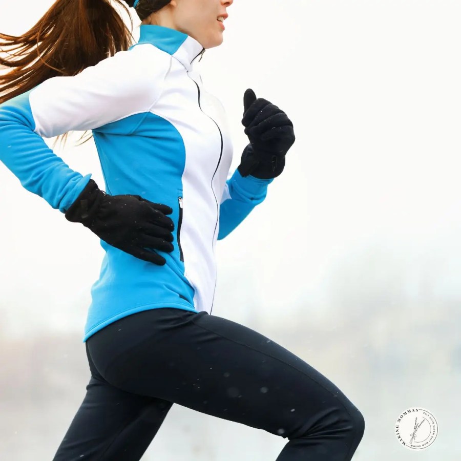 Woman running outdoors in cold weather wearing thermal running tights and gloves, an ideal Christmas gift for stay-at-home moms who enjoy winter workouts or staying active year-round.