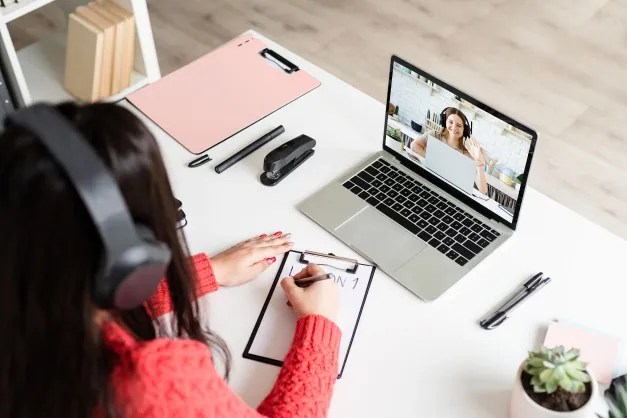 image of a woman on a virtual meeting with a client