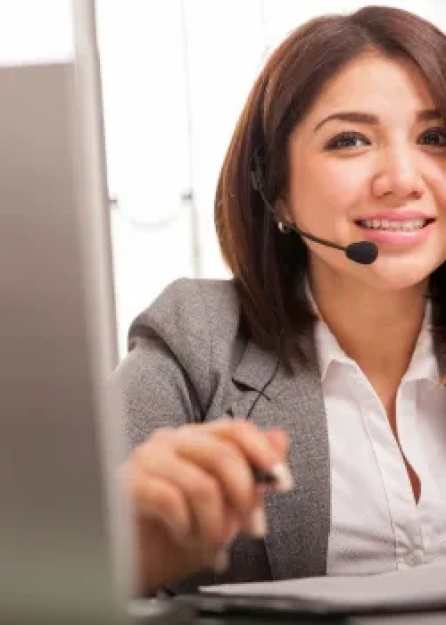 woman with microphone at computer