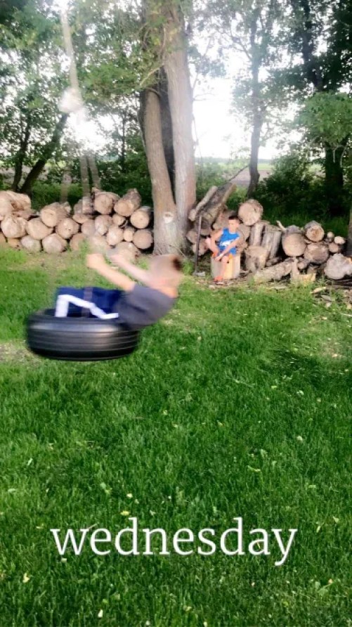boy on tire swing