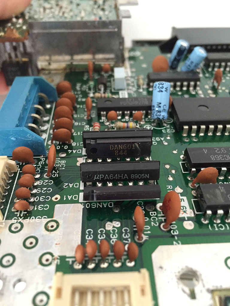 The small chip in the middle that starts with a "uPA..." is a Diode which is a semiconductor device that allows the flow of current in one direction only