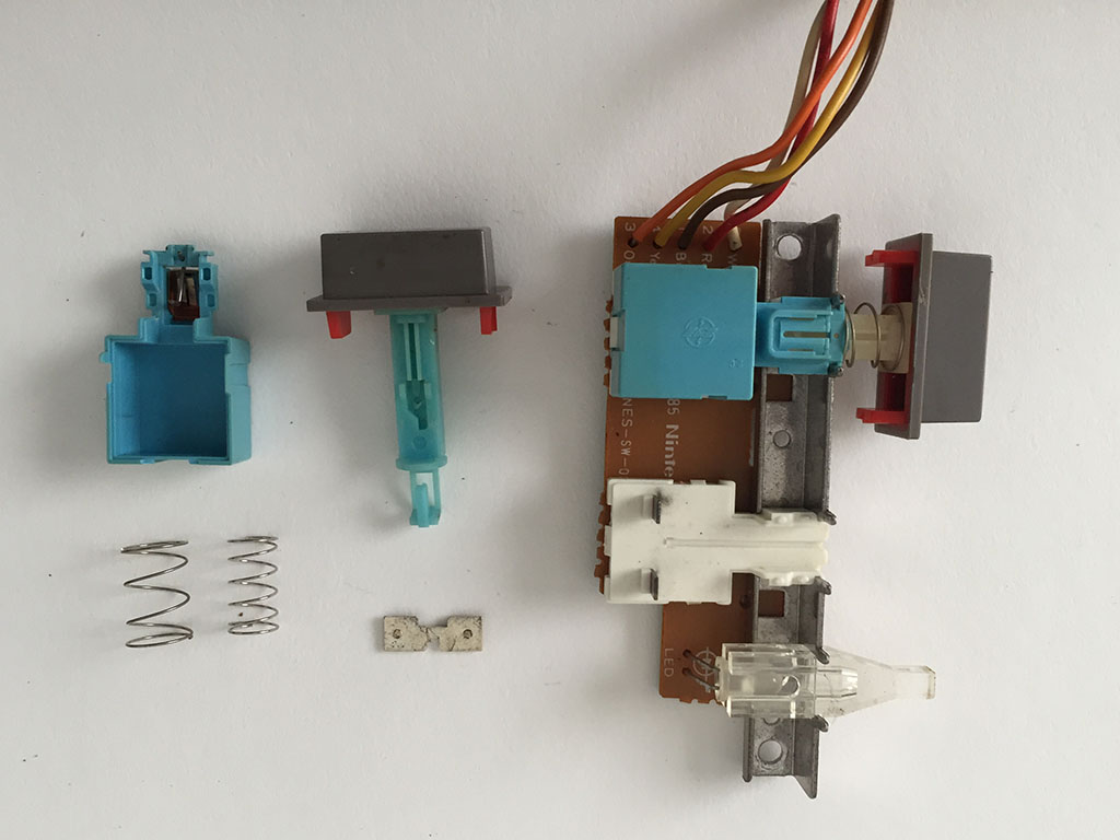 Here is a layout of all the small plastic & metal parts in the switch