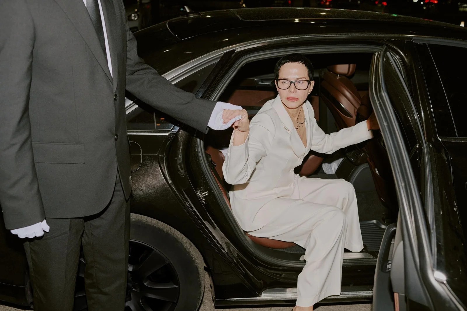 Luxury chauffeur service with professional driver and elegant car.