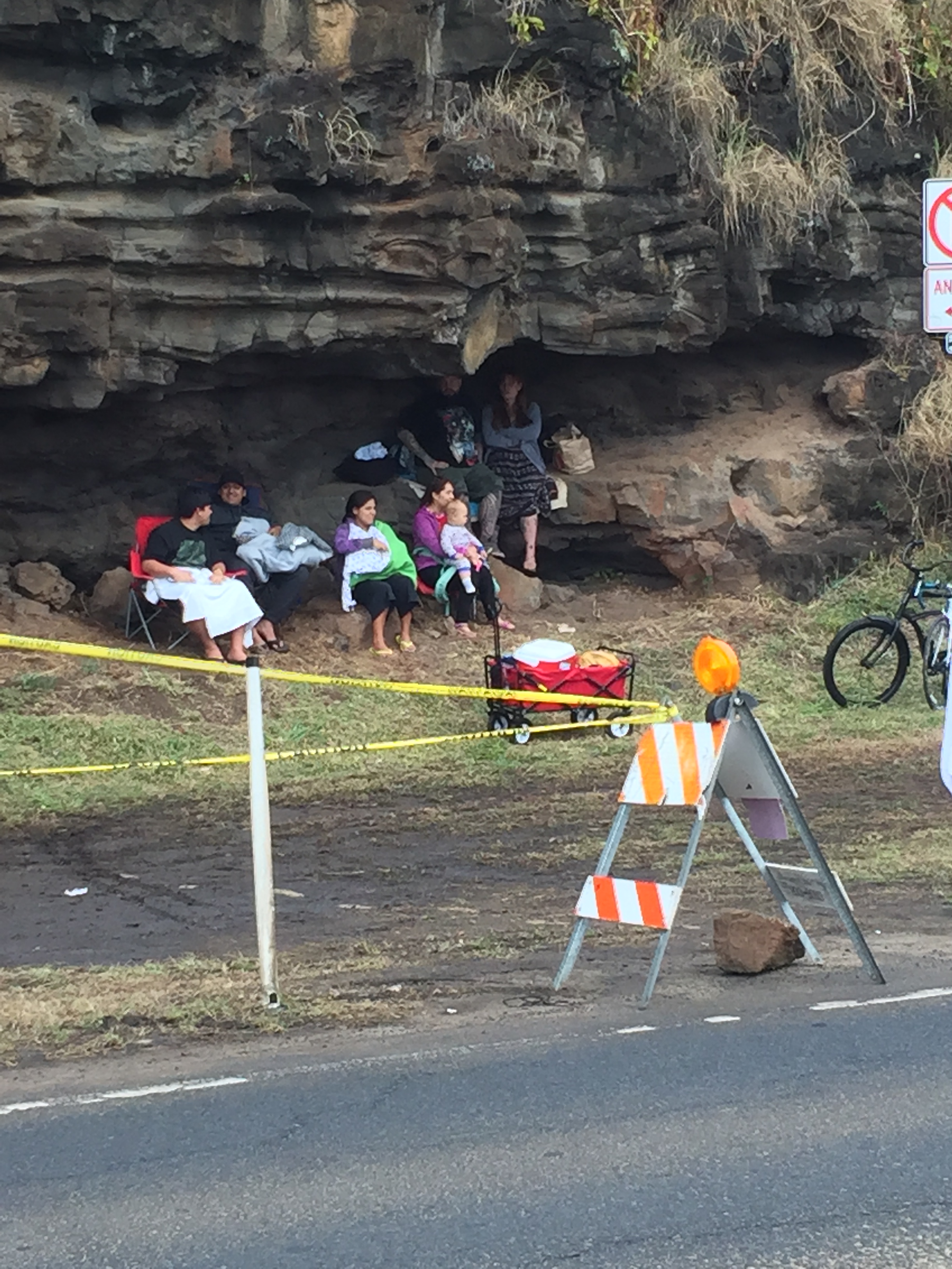 Cliffside "cave-dwellers" camp out to reserve prime spectator position.