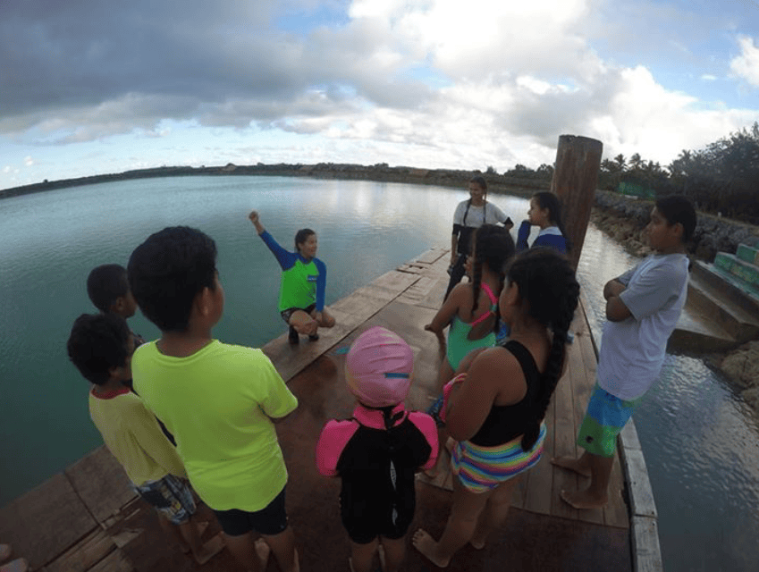 Learning how to signal for help if in trouble in the water (Pic thanks to Pou Panuve)