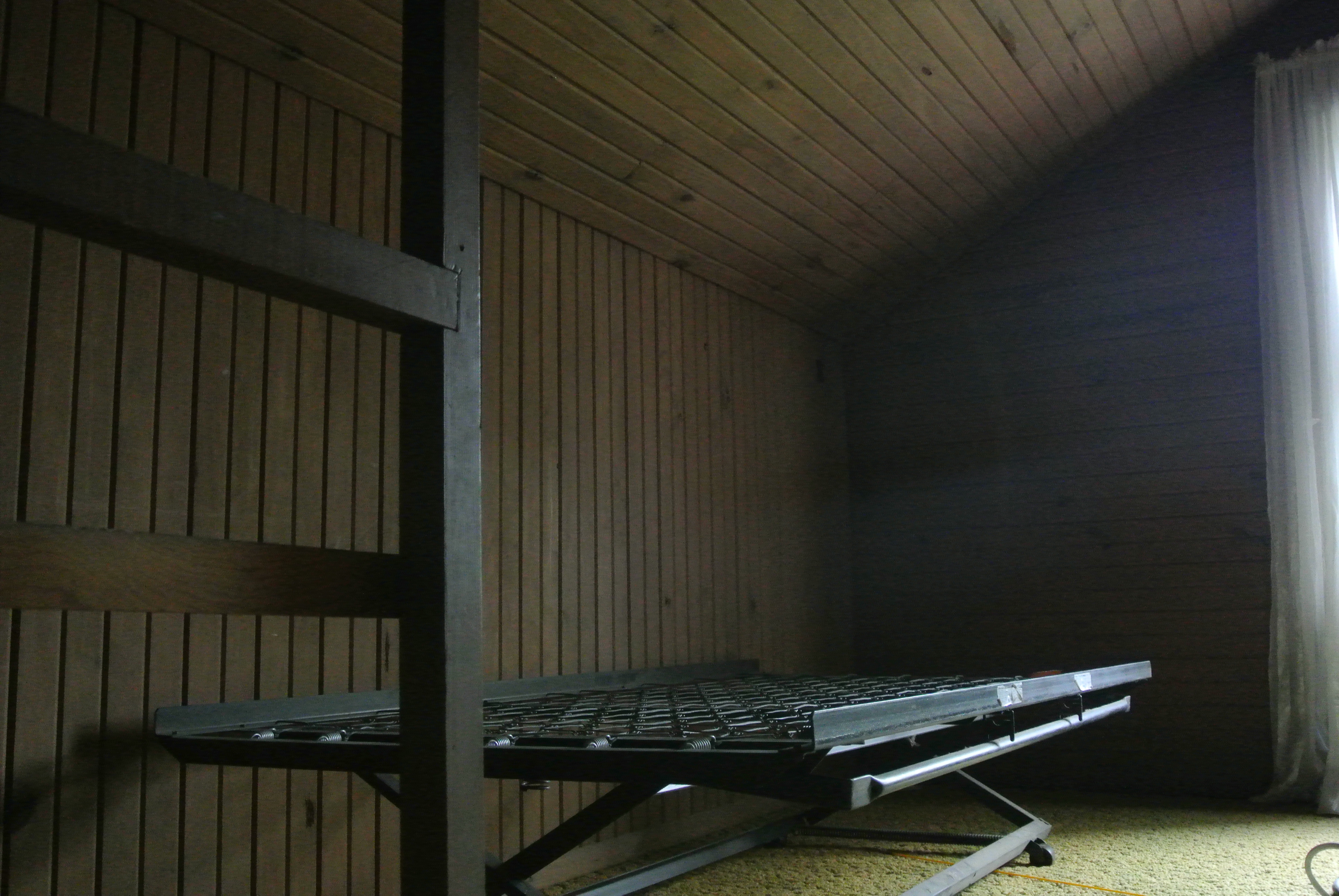 Wood paneling, no air, old carpet