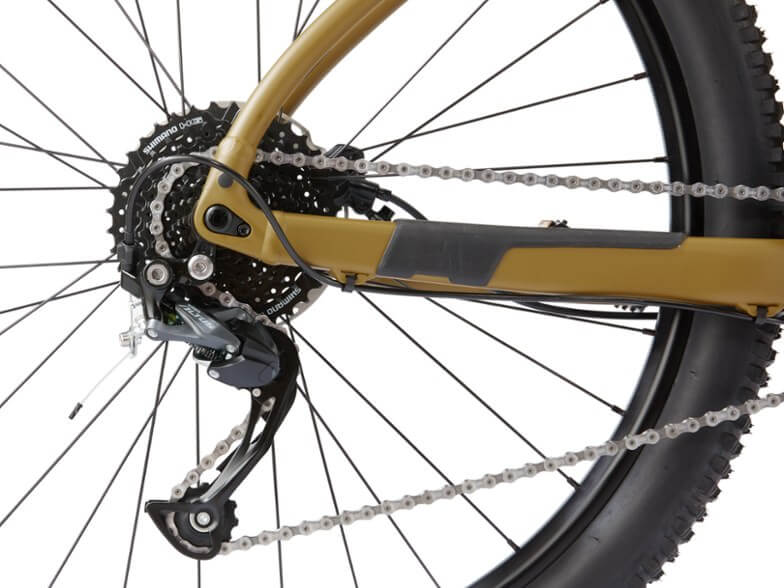 This photo shows a closeup of the rear derailleur on The REI Co-op Cycles DRT 1.2 mountain bike.