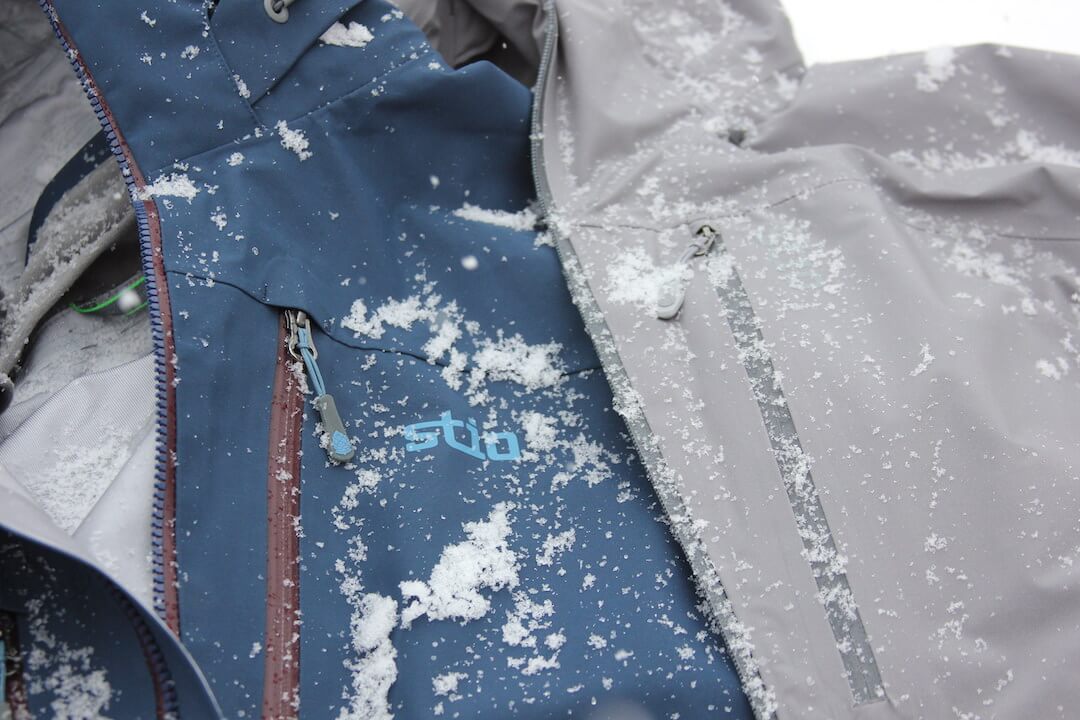 This photo shows the Stio Environ jacket next to the Stio Raymer jacket.