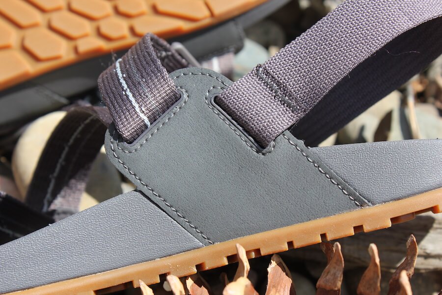 This review photo shows a closeup of the men's Chacos Lowdown Sandal strap connection in the rear.