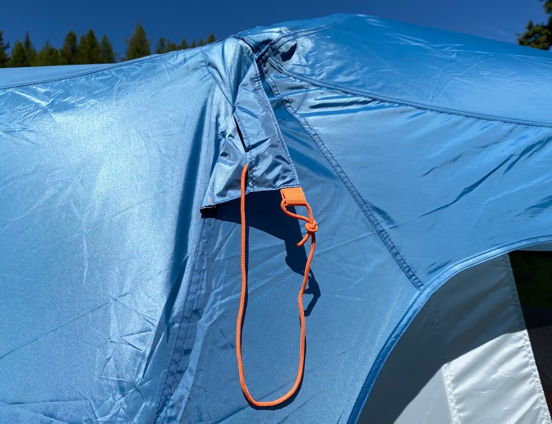 This review photo shows the Eureka! Copper Canyon LX 6 Tent guy line pocket on the rain fly.