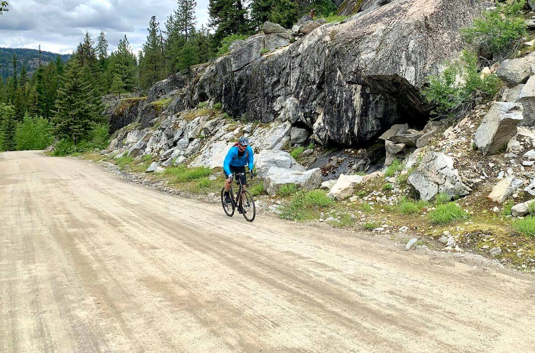 This photo shows the author riding on a gravel road.