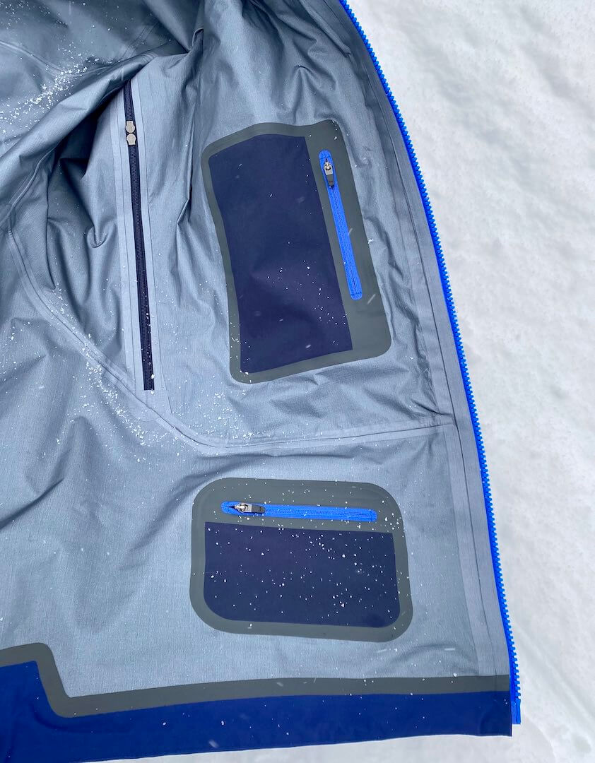 This photo shows the interior media and pass pockets in the Stio men's Objective Pro skiing jacket.