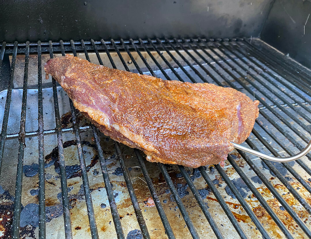 This Traeger review photo shows a beef tri-tip on a Traeger Pro 575 Pellet Grill with the Traeger meat thermometer.