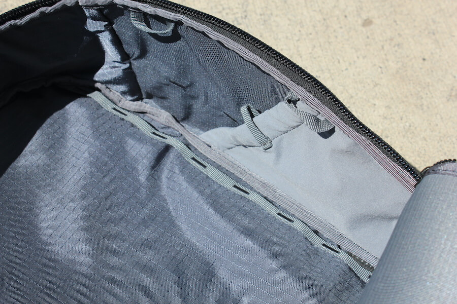 This photo shows the interior of the Able Carry Max Backpack.