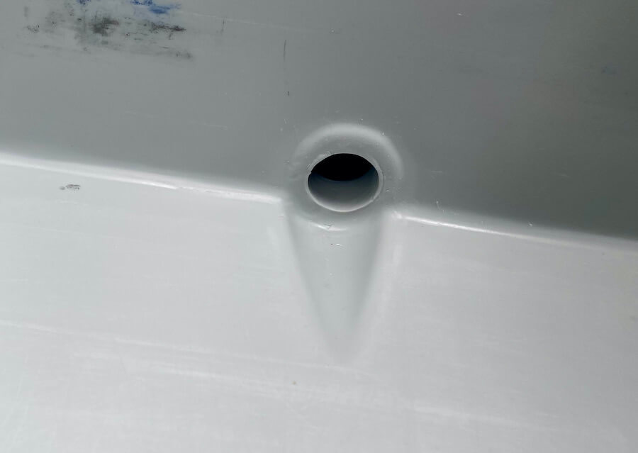This photo shows the smaller interior drain port inside the RTIC 65 QT Hard Cooler.