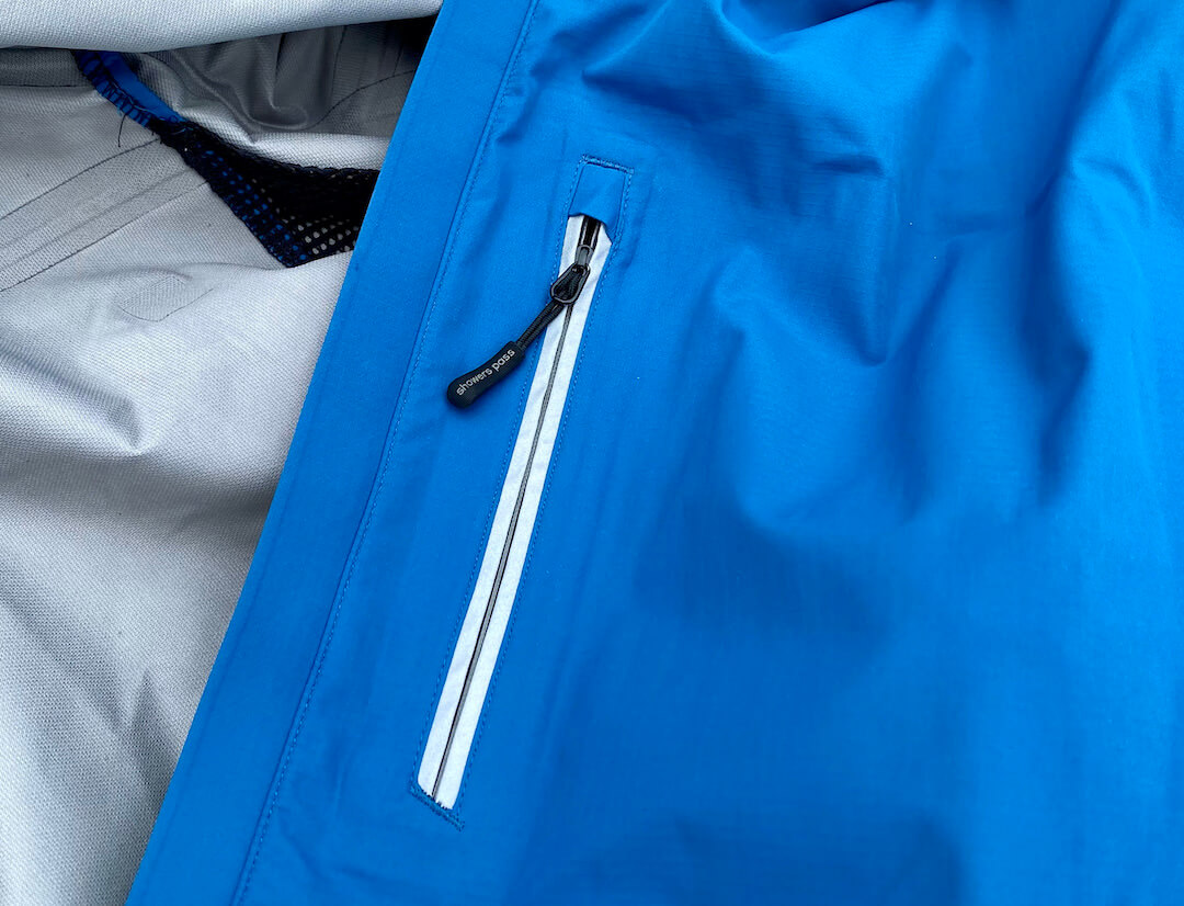 This photo shows a closeup of the Showers Pass Transit Jacket CC front pocket.